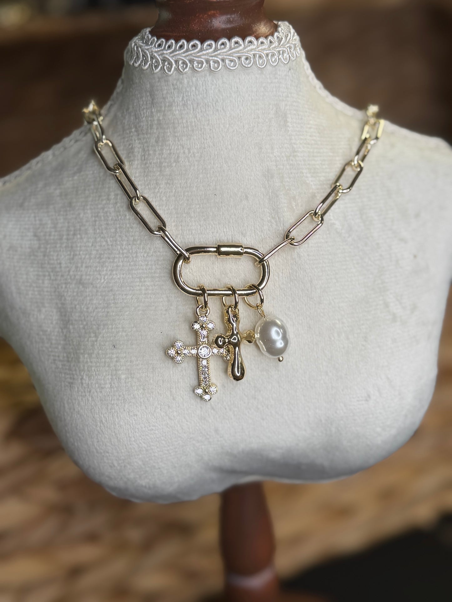 Gold necklace with cross and pearl pendants