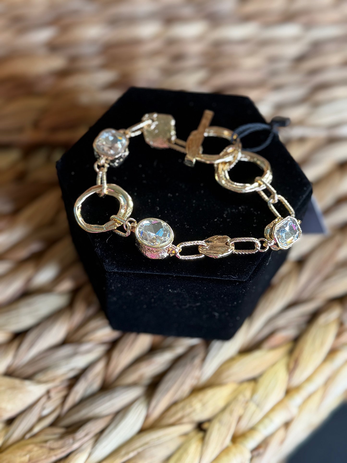 Gold linked bracelet with diamond stones and toggle closure