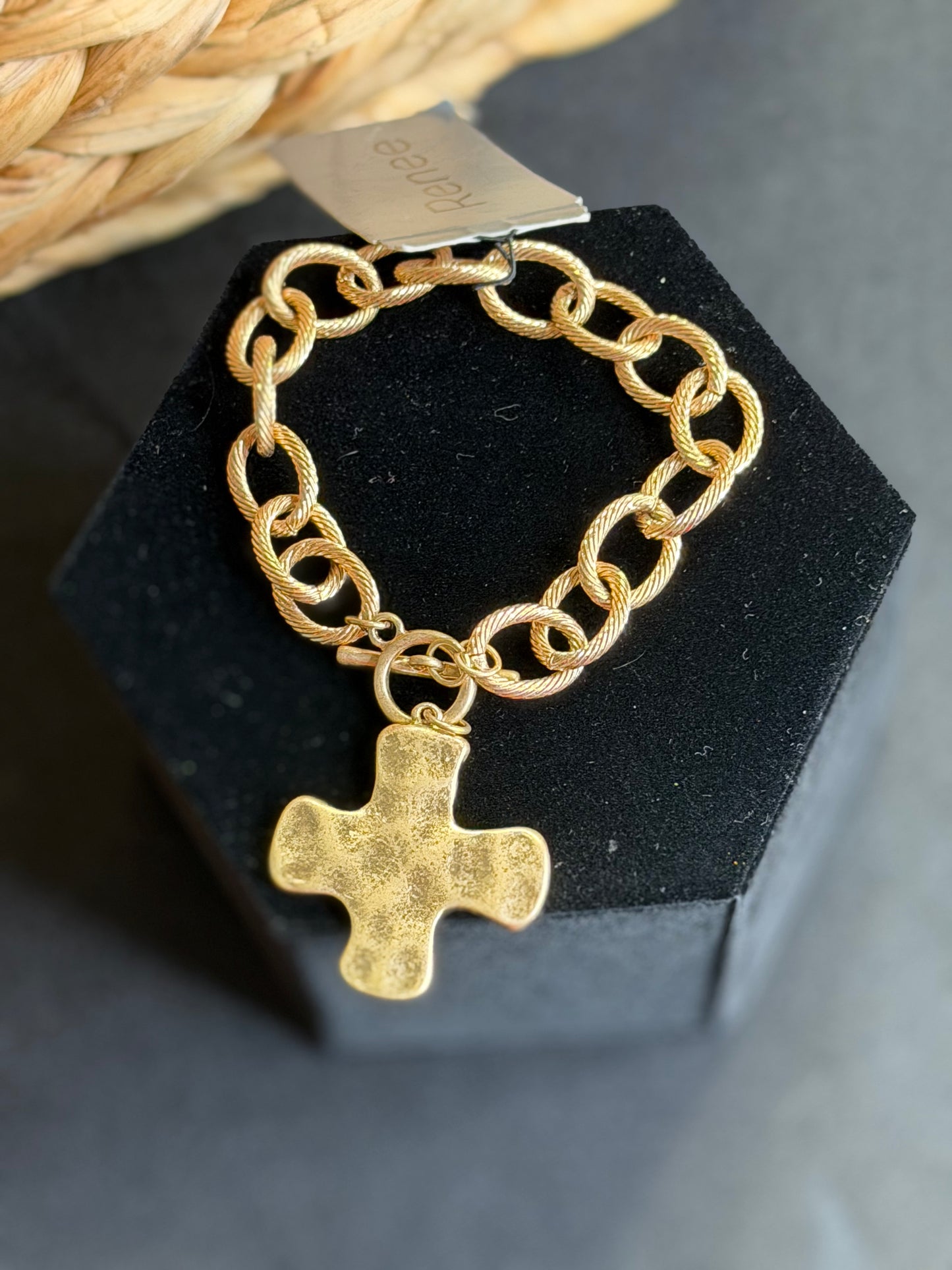 Gold chain bracelet with cross
