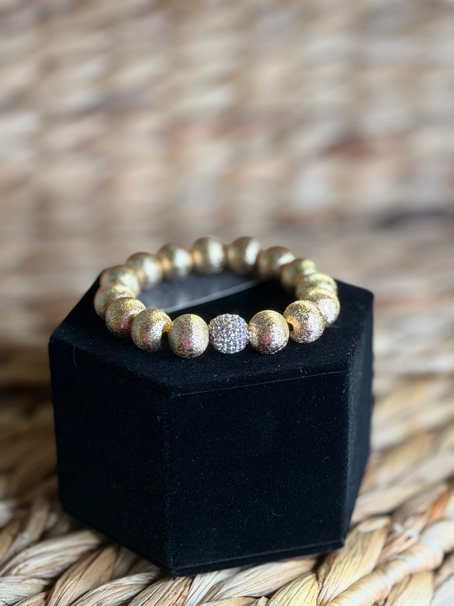 Stretchy gold bracelet with pavé bead