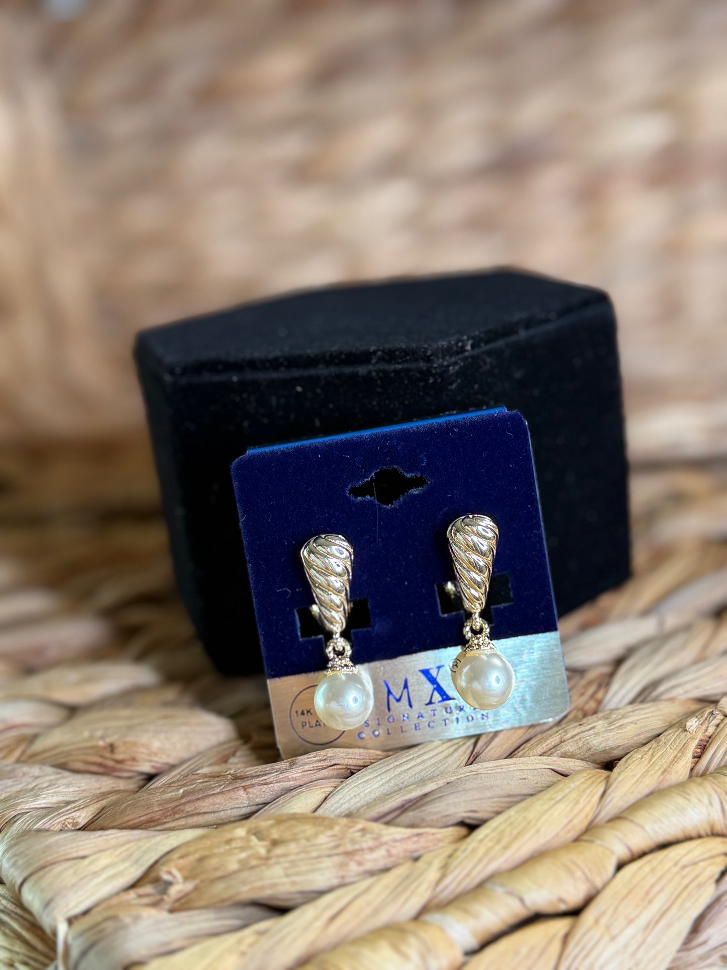 Gold earrings with hanging pearls