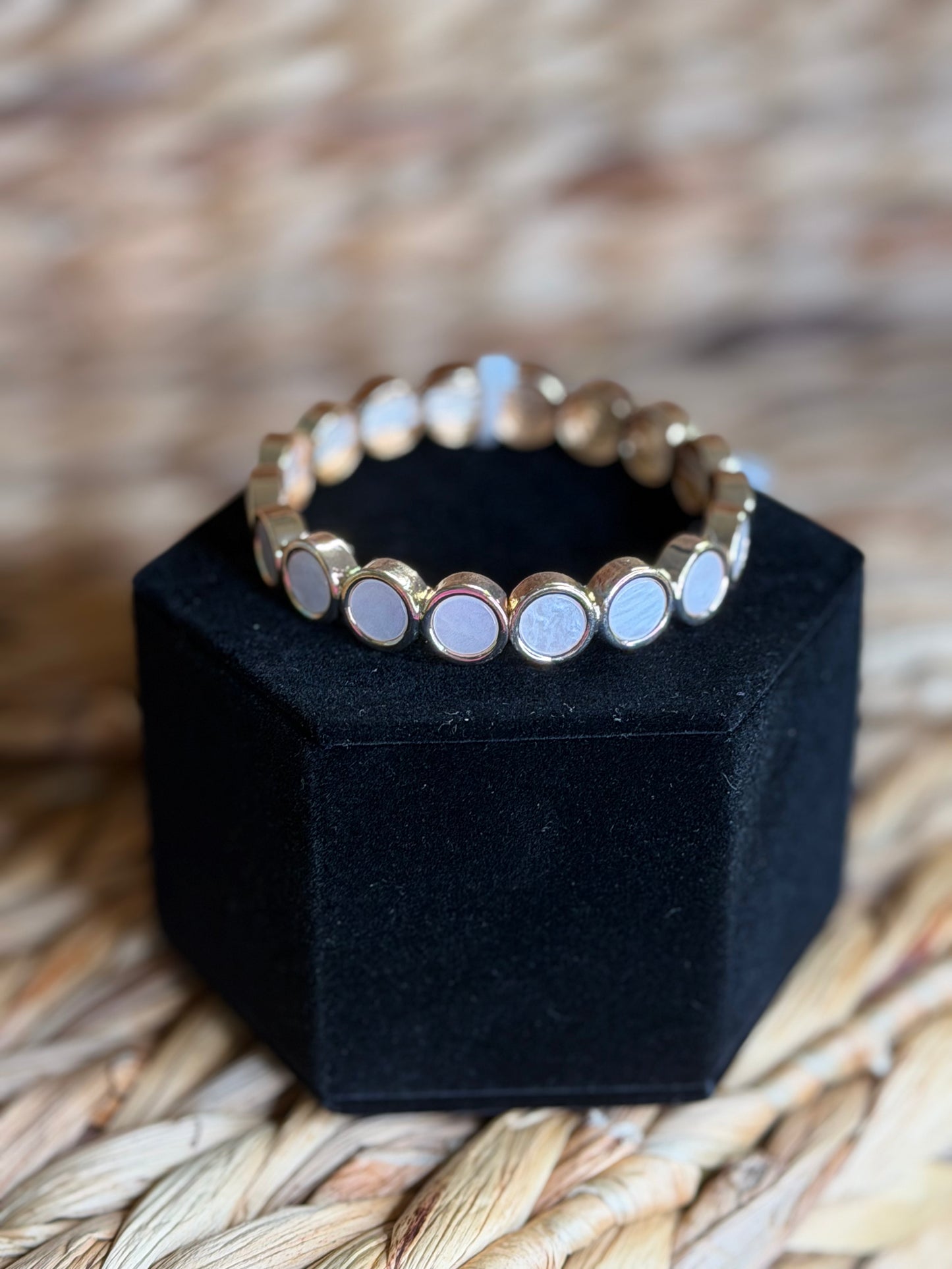 Stretchy gold bracelet with white stones