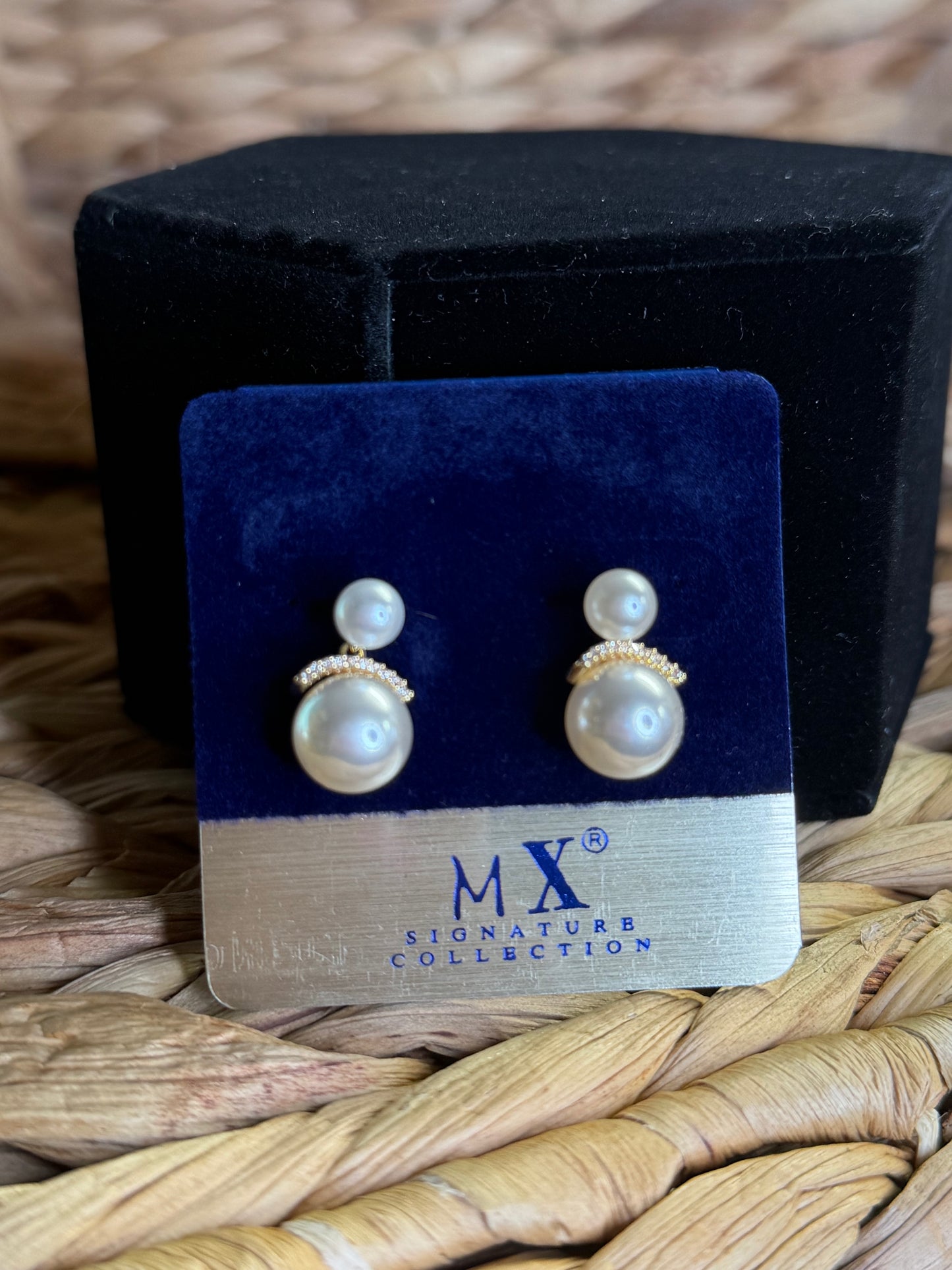 Gold earrings with hanging pearls