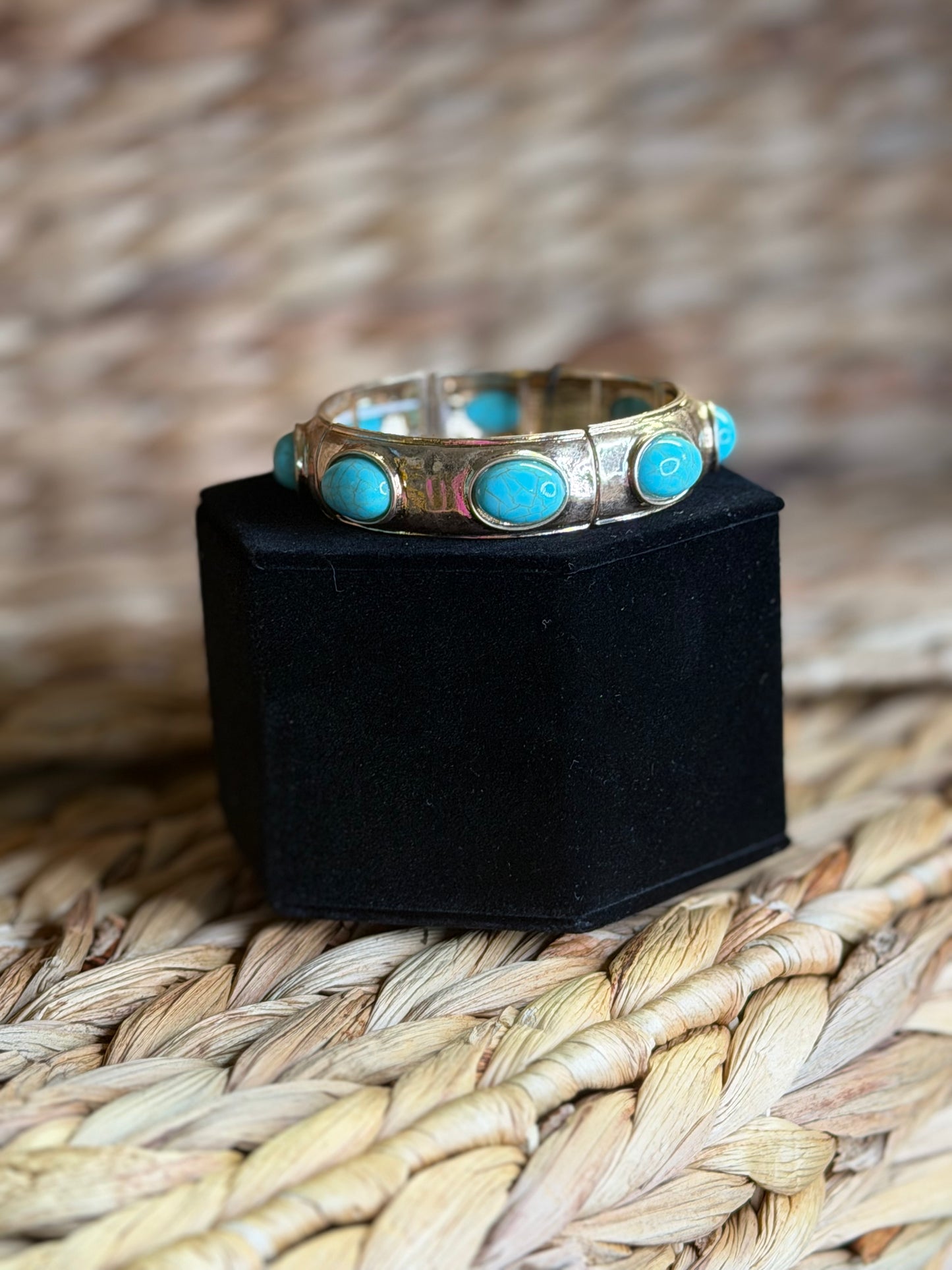 Stretchy gold bracelet with turquoise stones