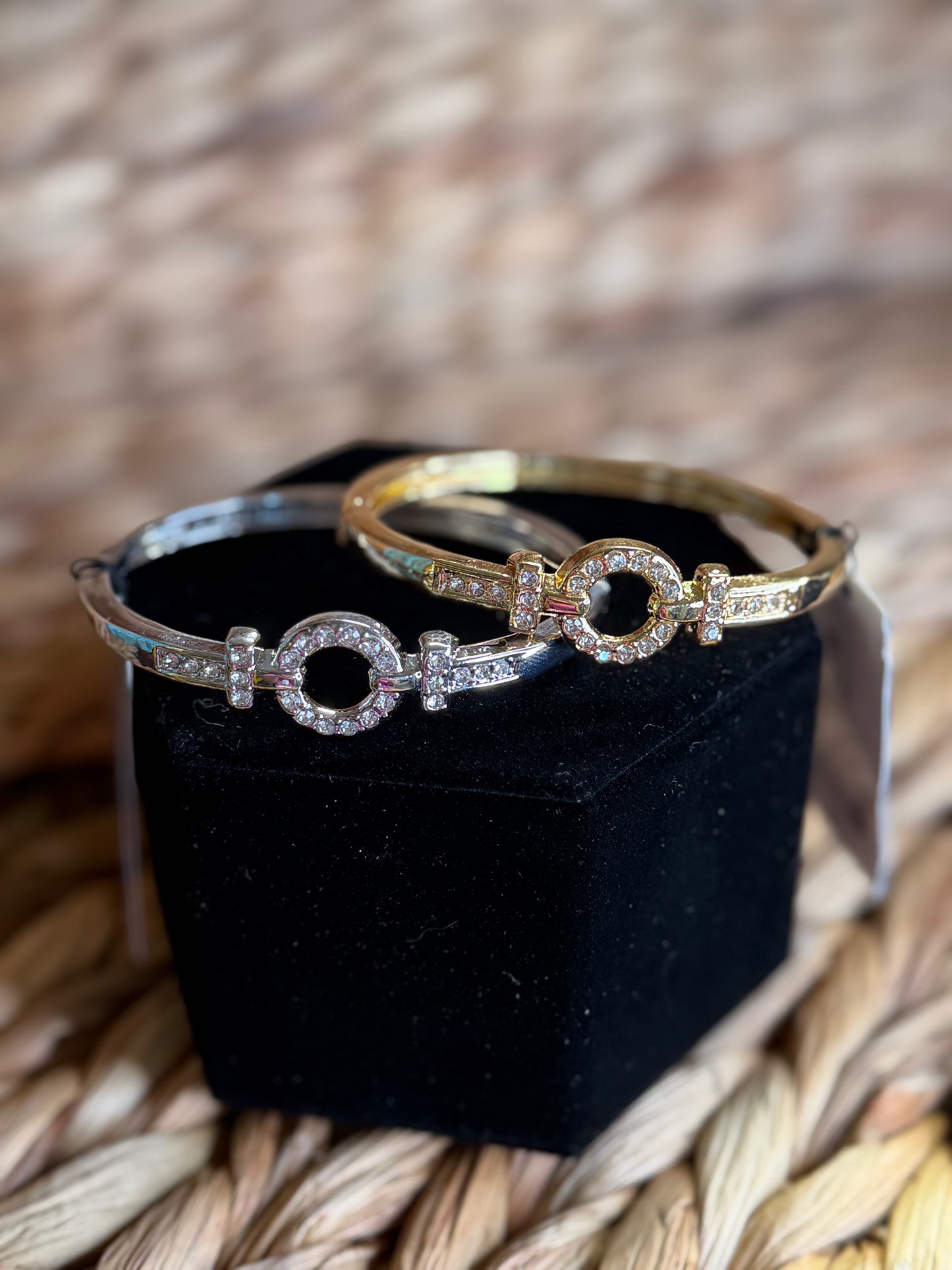 Gold and silver clamp bracelets with diamond round center