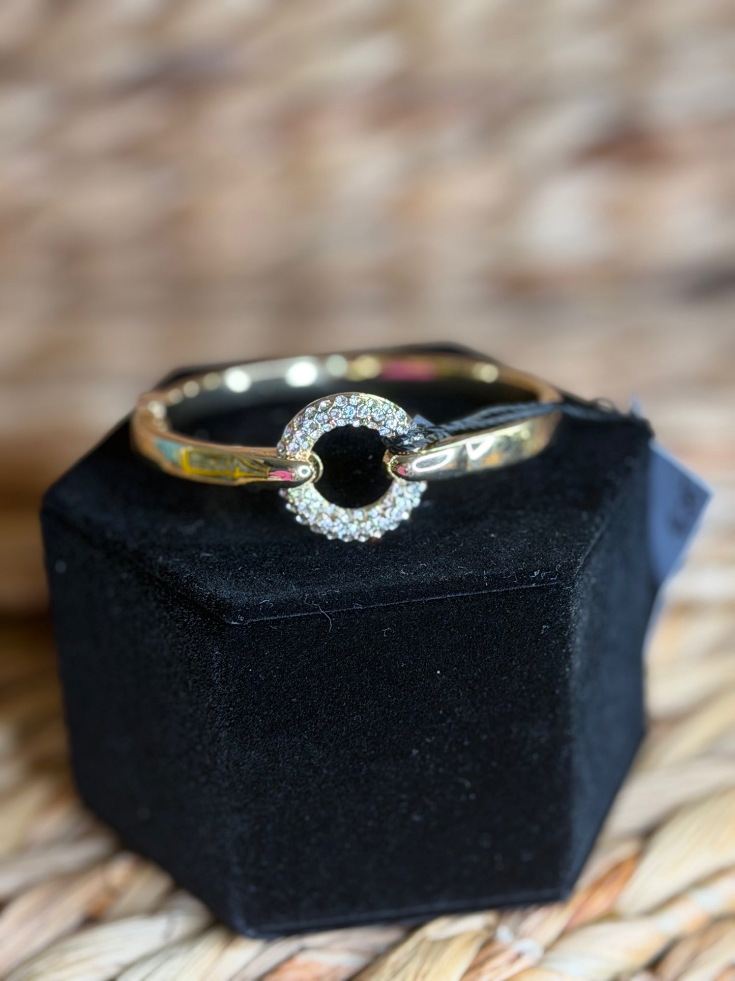 Gold hinge bracelet with pavé circle center