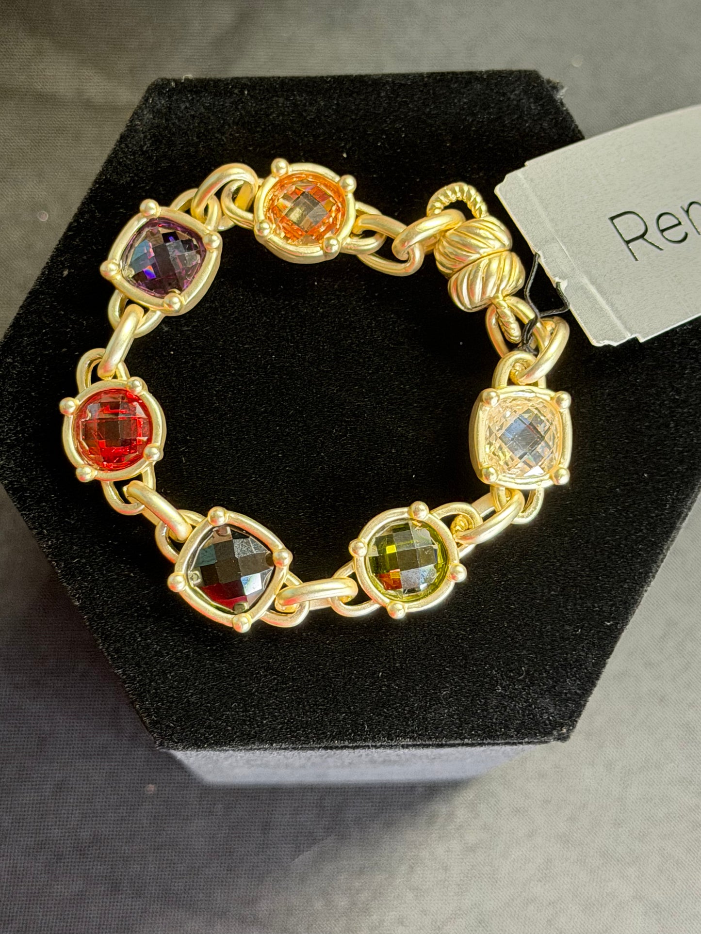 Gold chain bracelet with color stones