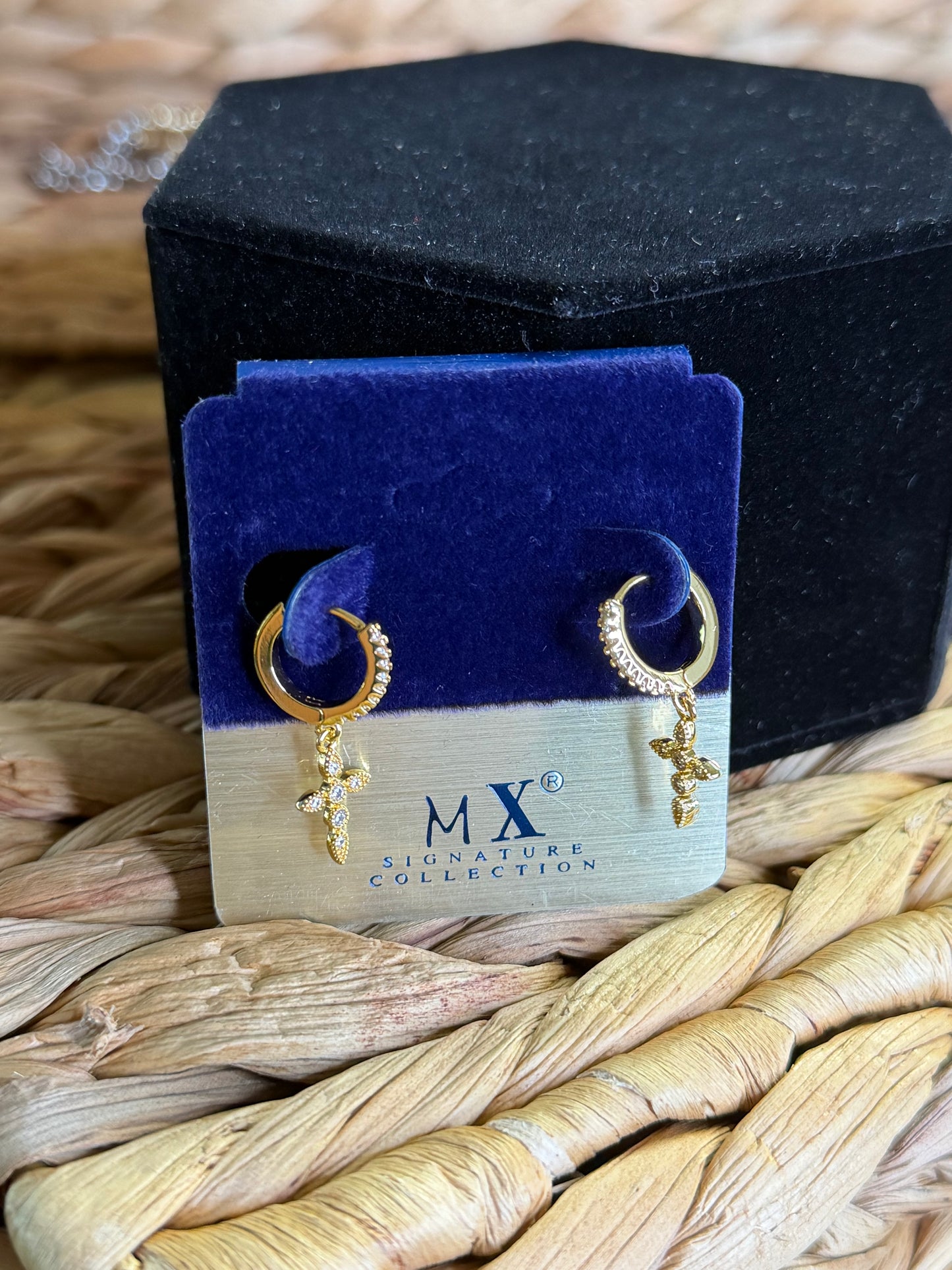 Gold hoop earrings with cross