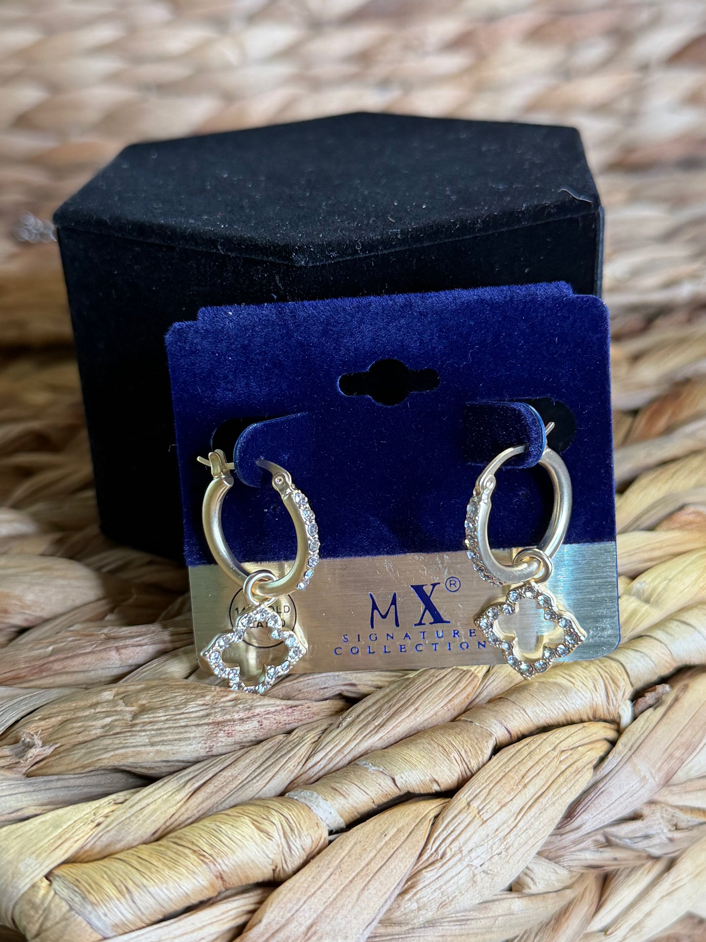 Gold hoop earrings with clovers