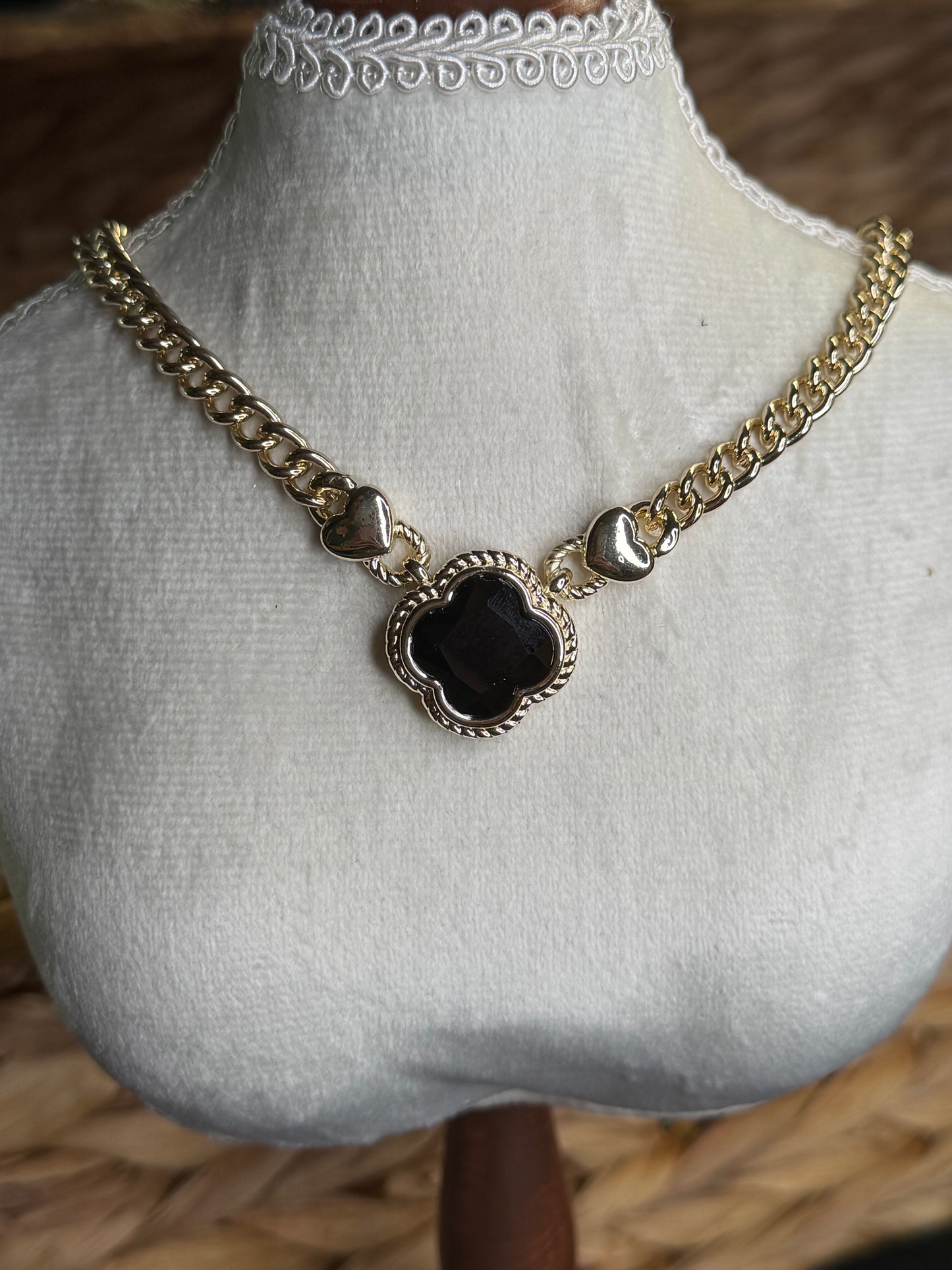 Gold necklace with black clover stone